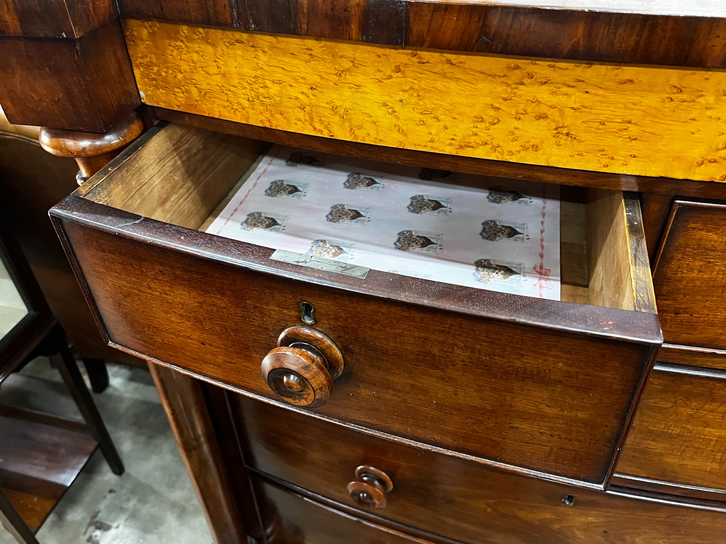 A large mid Victorian mahogany bow front chest of two short and three long drawers, bird's eye maple panel, width 114cm, depth 55cm, height 130cm